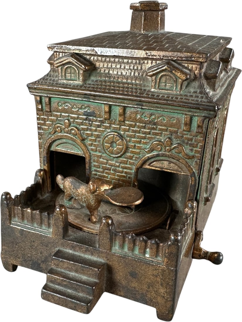 DOG ON TURNTABLE MECHANICAL BANK: 48. DOG ON TURNTABLE MECHANICAL BANK | Judd Manufacturing Co. Provenance: The Robert Booth Jr. Collection. | 5.5" h. | Could brighten with a little oiling, (Pristine Condition) | $400 - $700