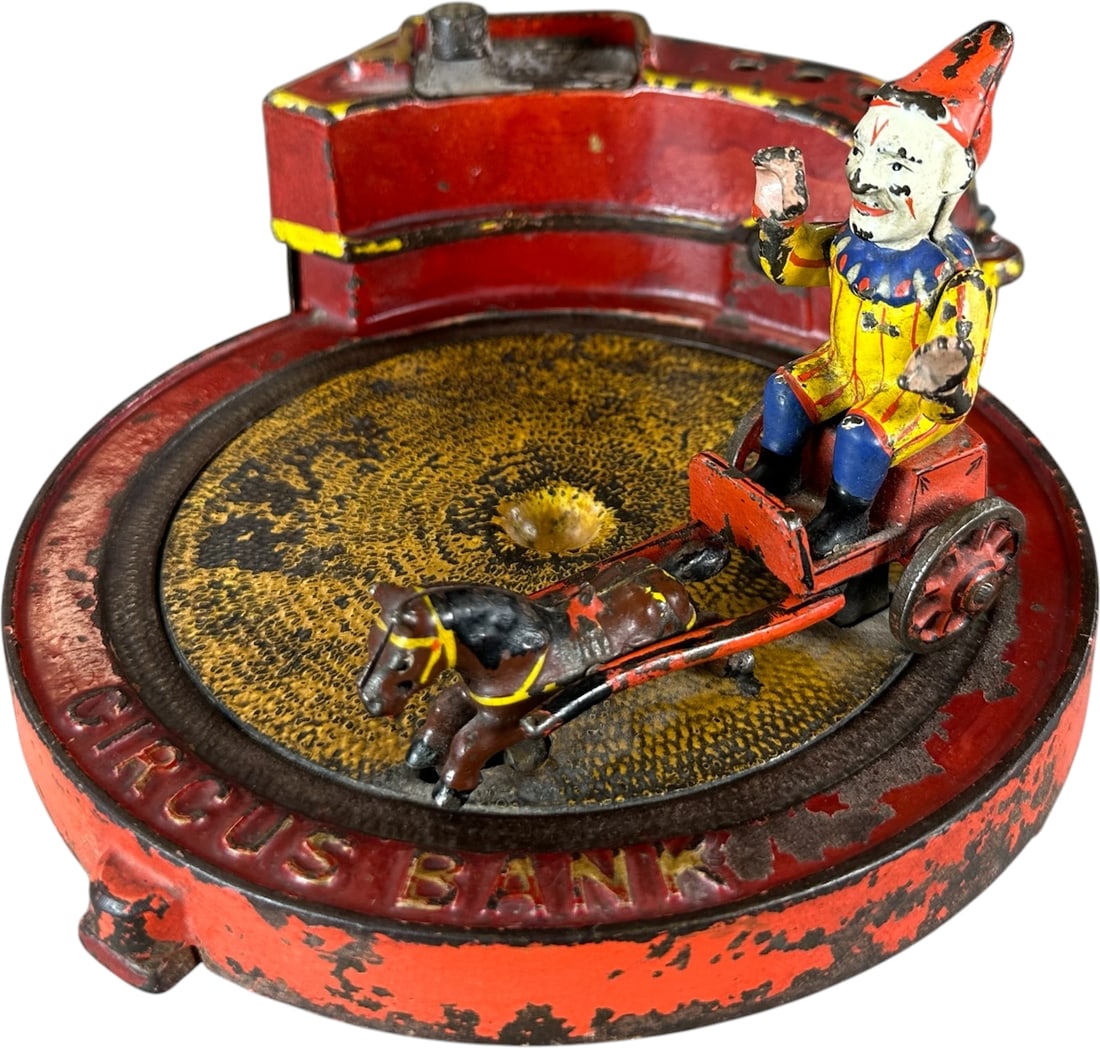 CIRCUS BANK MECHANICAL BANK: 56. CIRCUS BANK MECHANICAL BANK | J&E Stevens Co., another very popular circus theme, replacement removable handle at rear operates the bank, as it's cranked the clown rides pony cart in a circle and