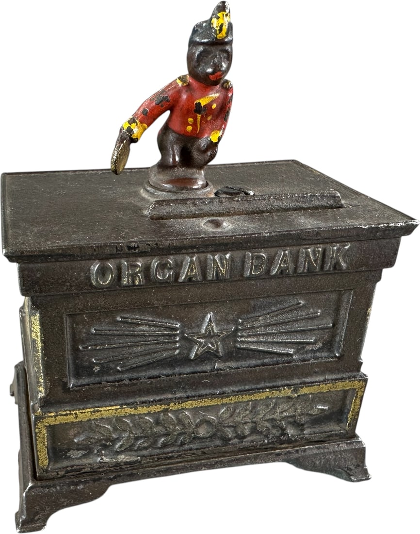 ORGAN BANK MINIATURE MECHANICAL BANK: 78. ORGAN BANK MINIATURE MECHANICAL BANK | Kyser & Rex Mfg. Provenance: The Robert Booth Jr. Collection. | 4.5" h. | Replaced pin and rear plate, (Excellent Condition) | $200 - $400