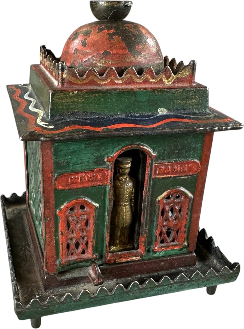 NEW MECHANICAL BANK: 92. NEW MECHANICAL BANK | J&E Stevens Co. Provenance: The Robert Booth Jr. Collection. | 6.5" l. | Other than paint wear to top dome, the bank is in (Excellent Condition) | $400 - $700