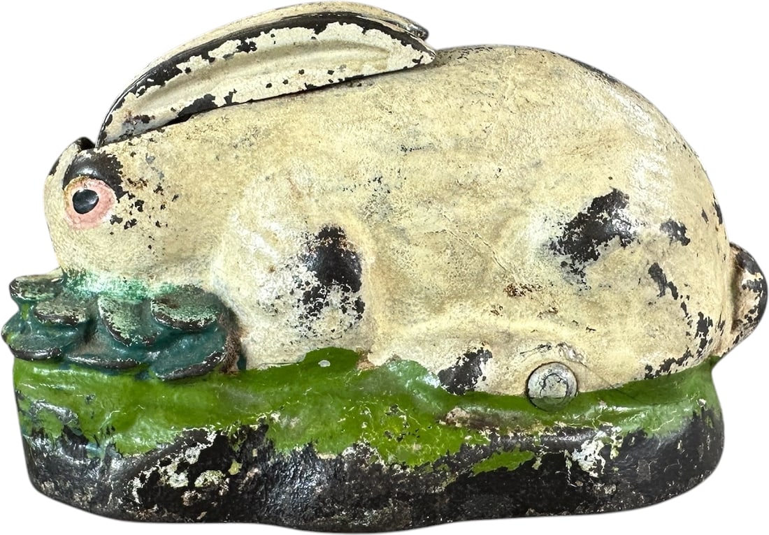 KILGORE RABBIT IN CABBAGE MECHANICAL BANK: 97. KILGORE RABBIT IN CABBAGE MECHANICAL BANK | Kilgore Manufacturing Co., Westerville OH. Provenance: The Robert Booth Jr. Collection. | 4.5" l. | Authentic bank with some areas of touch-up to