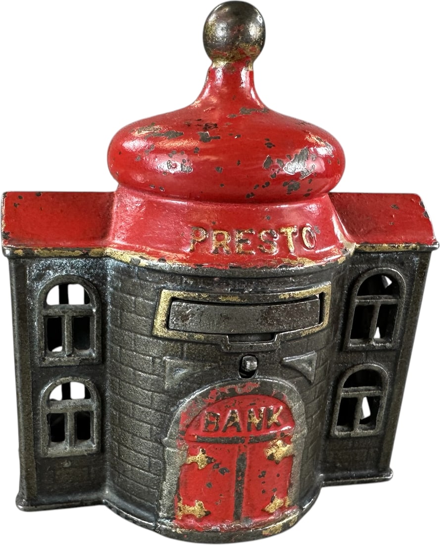 PRESTO MECHANICAL BANK: 103. PRESTO MECHANICAL BANK | Kenton Hardware Co. Provenance: The Robert Booth Jr. Collection. | 4.5" h. | With original trap, (Excellent Condition) | $200 - $300
