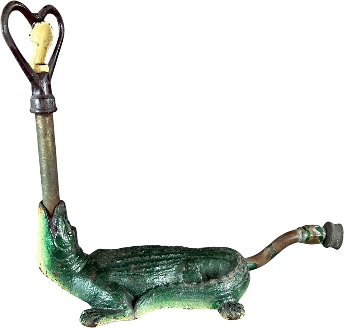 ALLIGATOR FIGURAL GARDEN SPRINKLER: 113. ALLIGATOR FIGURAL GARDEN SPRINKLER | Cast iron example, well molded ornamental and functional lawn sprinkler with hear-shaped sprayer. Ex: The Bob Brady Collection. | 14.5" l. | (Pristine