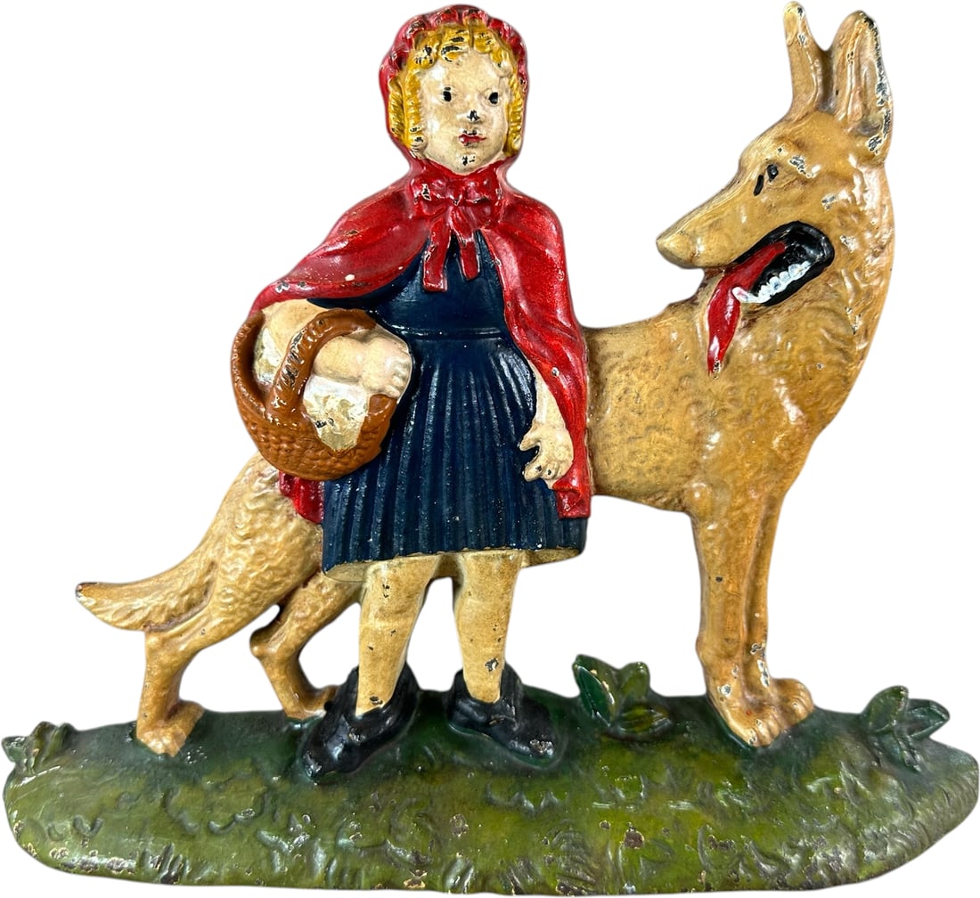 LITTLE RED RIDING HOOD DOORSTOP: 126. LITTLE RED RIDING HOOD DOORSTOP | Embossed "NUYDEA , Pat. Pending 860 LITTLE RED RIDING HOOD" on back. charming nursery rhythm theme, well executed casting, great imagery to scale of wolf behind