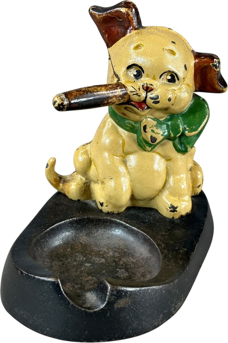 HUBLEY CIGAR SMOKING DOG ASHTRAY: 143. HUBLEY CIGAR SMOKING DOG ASHTRAY | Provenance: Donal Markey Collection #614. Ex: The Bob Brady Collection. | 6" l. | Minor chips to paint, (Excellent Condition) | $400 - $600