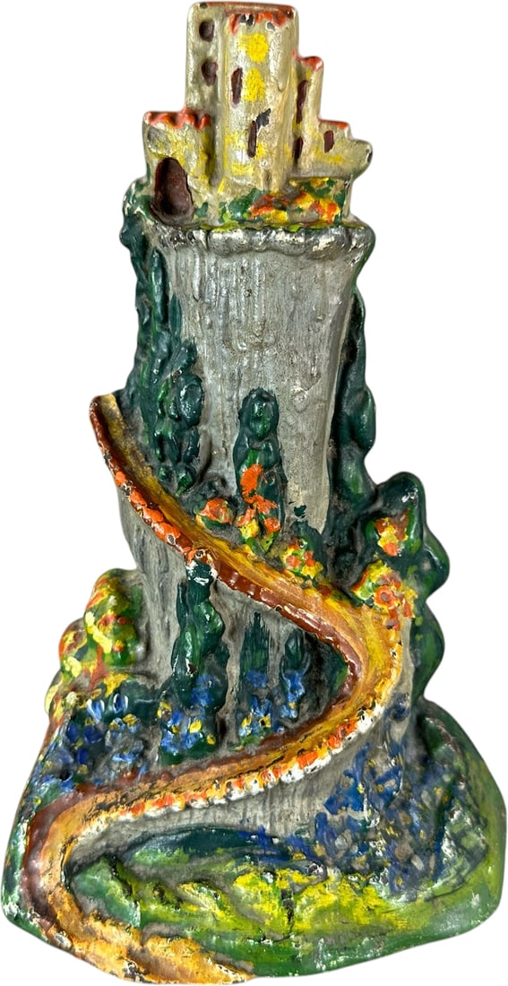 CASTLE ON THE HILL DOORSTOP: 144. CASTLE ON THE HILL DOORSTOP | Albany Foundry, cast iron, beautiful fairytale castle sits high atop a hill with painted foliage and winding pathway. Ex: The Bob Brady Collection. | 8" h. | (Near