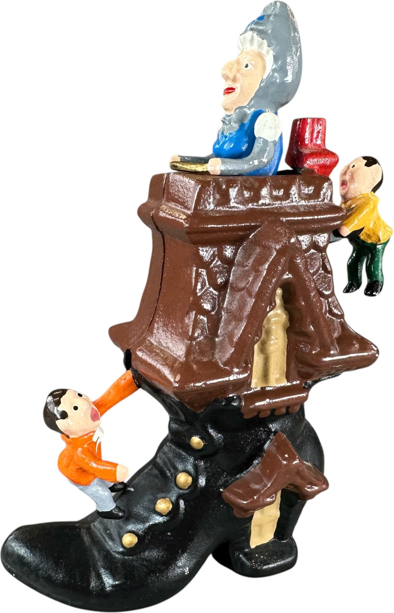 REYNOLDS SHOE HOUSE MECHANICAL BANK: 156. REYNOLDS SHOE HOUSE MECHANICAL BANK | Catalogue # 53-M, 1994, Edition 2 of 50. Ex: Max Berry Collection. | 8.5" h. | (Pristine to Near Mint Condition) | $200 - $300