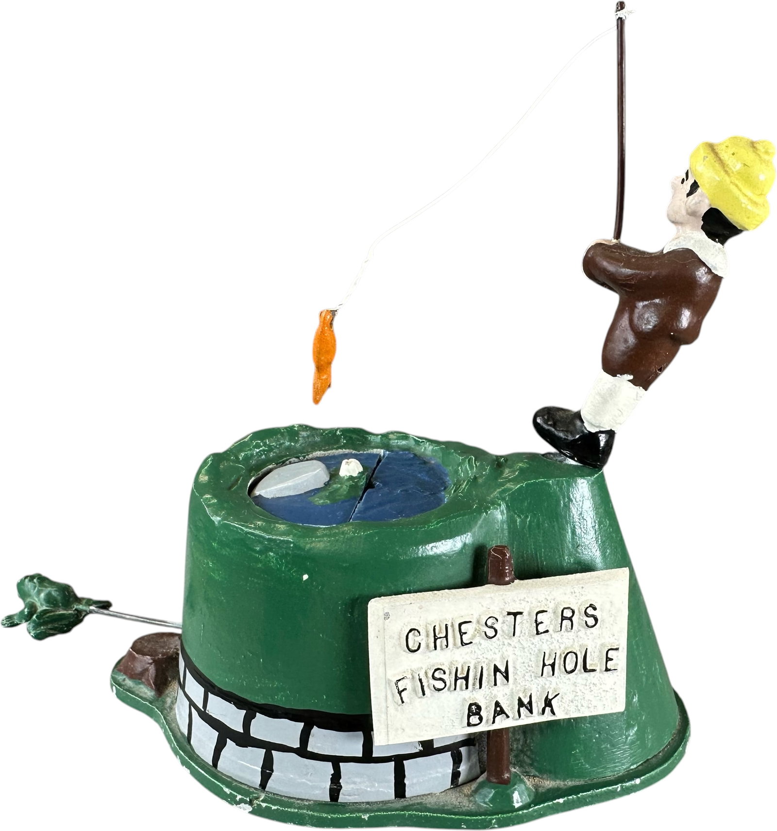 REYNOLDS CHESTERS FISHING HOLE MECHANICAL BANK: 179. REYNOLDS CHESTERS FISHING HOLE MECHANICAL BANK | Catalogue # 17-M, 1974, Edition of 10. Ex: Max Berry Collection. | 6" h. | (Pristine to Near Mint Condition) | $200 - $400