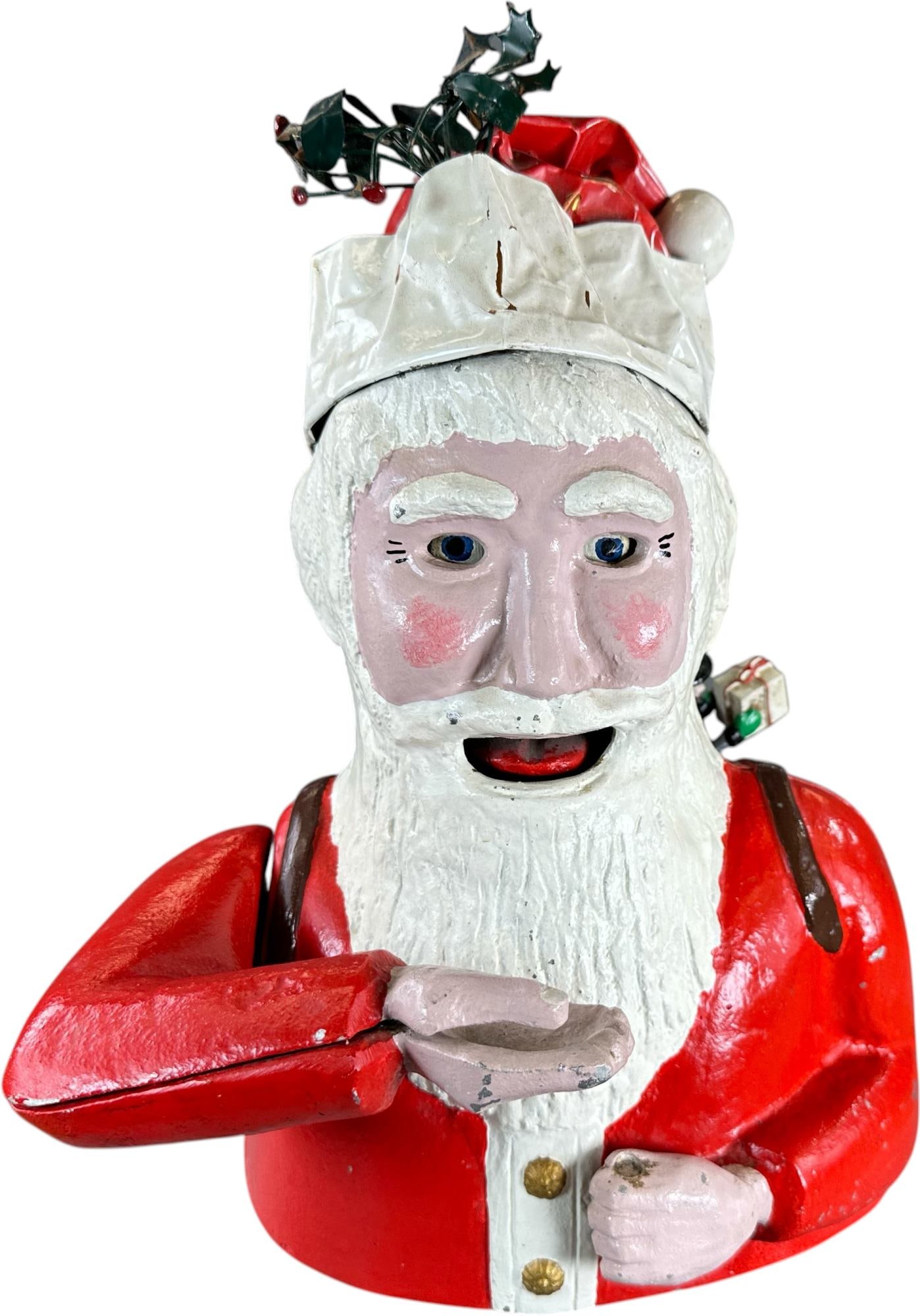 REYNOLDS FATHER CHRISTMAS MECHANICAL BANK: 183. REYNOLDS FATHER CHRISTMAS MECHANICAL BANK | Catalogue # 10-M, 1972, Edition 5 of 25. Ex: Max Berry Collection. | 15" h. | (Excellent Condition) | $400 - $800