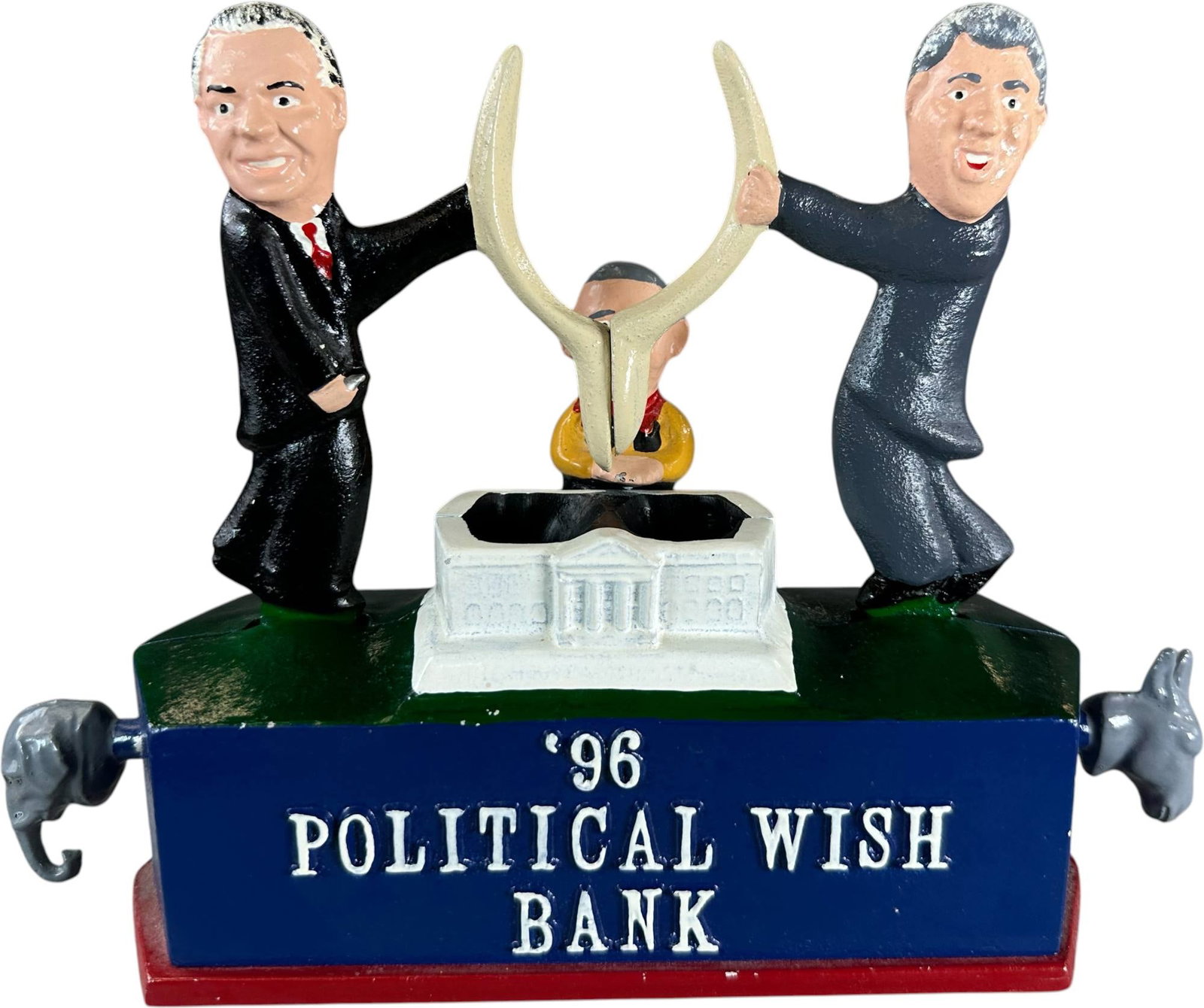 REYNOLDS POLITICAL WISH MECHANICAL BANK: 188. REYNOLDS POLITICAL WISH MECHANICAL BANK | Catalogue # 56-M, 1996, Edition 2 of 50. Ex: Max Berry Collection. | 10.5" l. | (Pristine to Near Mint Condition) | $200 - $400