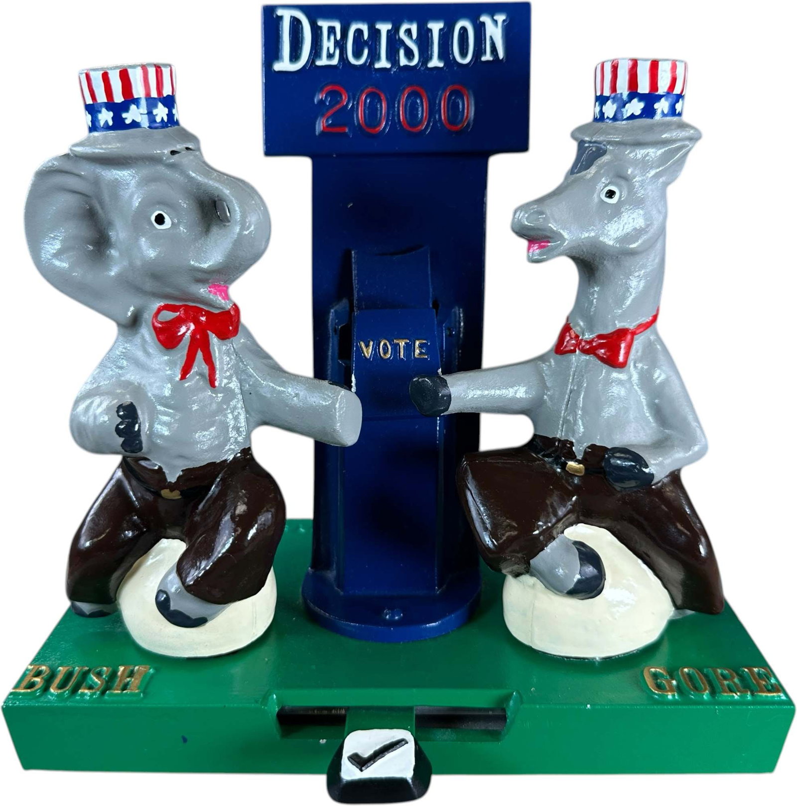 REYNOLDS DECISION BUSH GORE MECHANICAL BANK: 189. REYNOLDS DECISION BUSH GORE MECHANICAL BANK | "Decision 2000 Bush Gore", Catalogue # 64-M, 2000, Edition 2 of 50. Ex: Max Berry Collection. | 8" l. | (Near Mint Condition) | $300 - $400