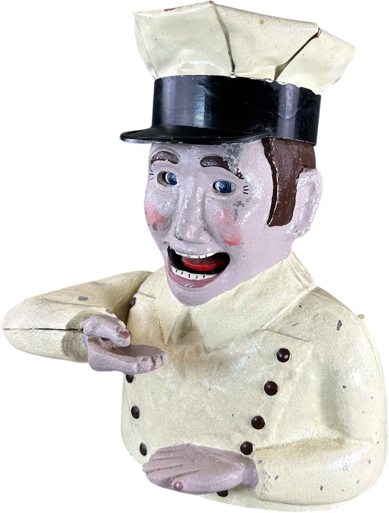 REYNOLDS THE TOY COLLECTOR MECHANICAL BANK: 210. REYNOLDS THE TOY COLLECTOR MECHANICAL BANK | Catalogue # 7M-G, 1972. Ex: Max Berry Collection. | 12.5" h. | Missing goggles on hat and toy in hand (Excellent Condition) | $800 - $1,600