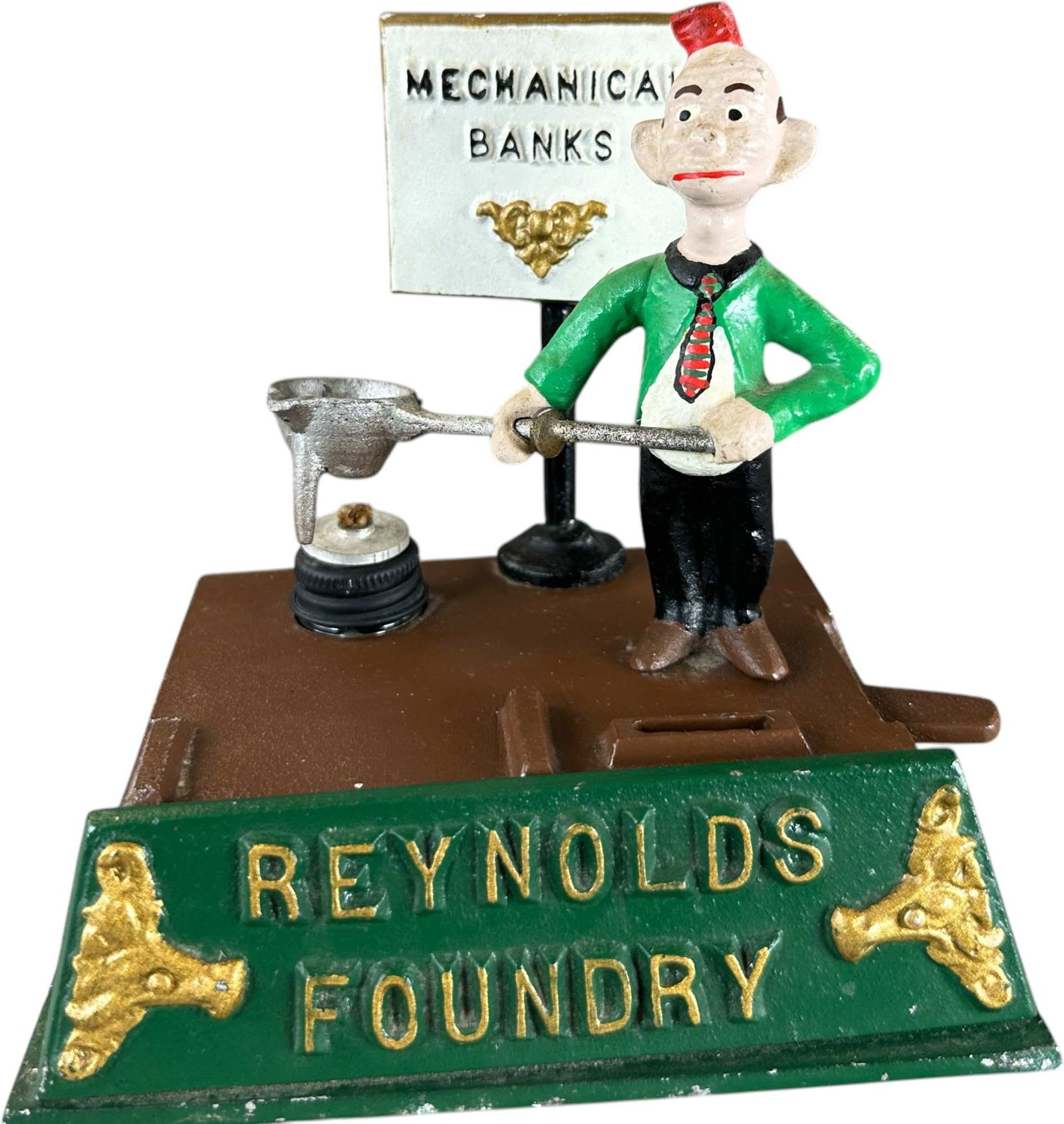 REYNOLDS FOUNDRY MECHANICAL BANK: 214. REYNOLDS FOUNDRY MECHANICAL BANK | Catalogue # 26-M, 1974, Edition 2 of 15. Ex: Max Berry Collection. | 6" l. | (Excellent to Pristine Condition) | $400 - $800