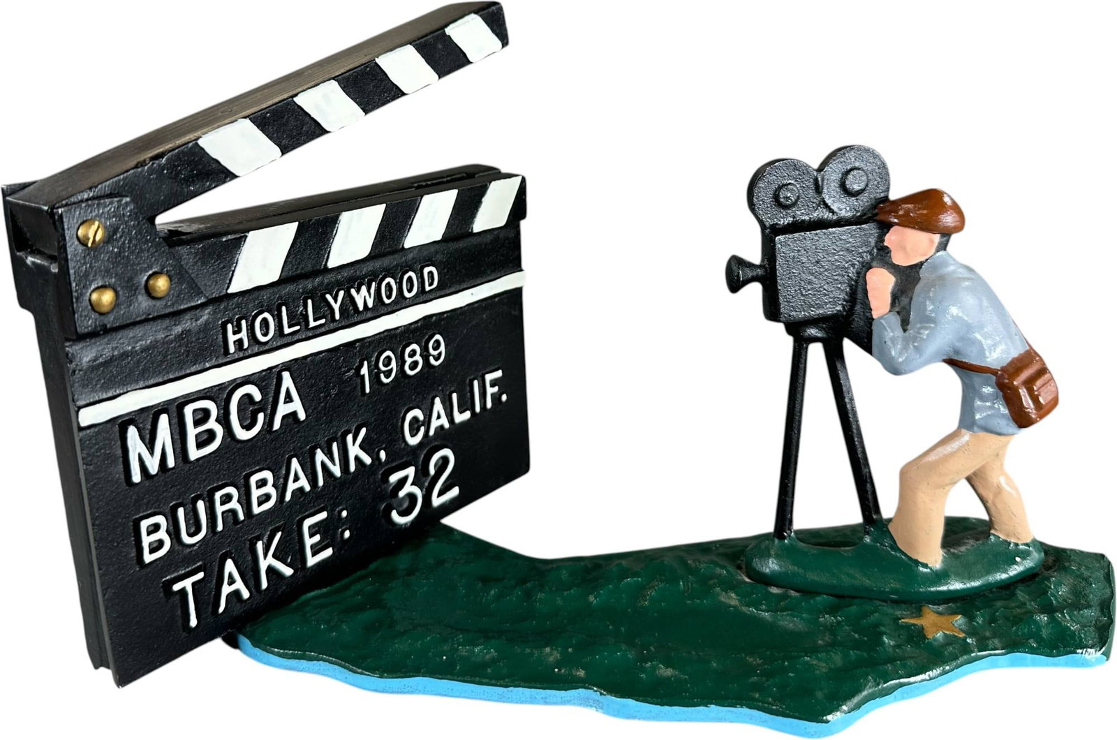 REYNOLDS HOLLYWOOD MECHANICAL BANK: 221. REYNOLDS HOLLYWOOD MECHANICAL BANK | Catalogue # 46-M, 1989, EDITON 2 of 35. Ex: Max Berry Collection. | 10" l. | (Near Mint Condition) | $250 - $500