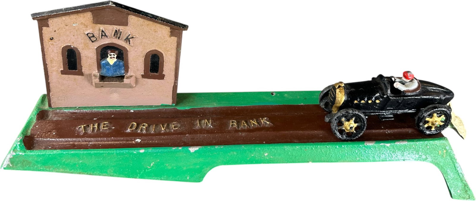 REYNOLDS DRIVE IN MECHANICAL BANK: 241. REYNOLDS DRIVE IN MECHANICAL BANK | Catalogue # 3-M, 1971, Edition of 10. Ex: Max Berry Collection. | 18" l. | (Excellent Condition) | $300 - $600