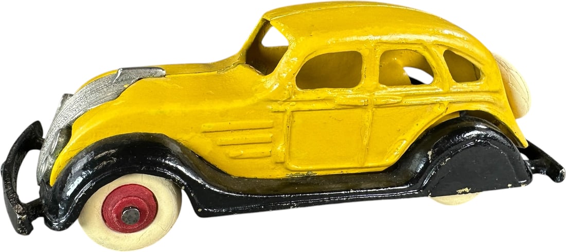 DENT 1934 CHRYSLER AIRFLOW - BRASS: 266. DENT 1934 CHRYSLER AIRFLOW - BRASS | The body of the car is painted brass leading us to believe this is either a pattern or prototype of this already scarce smaller scale auto. Provenance: Ira