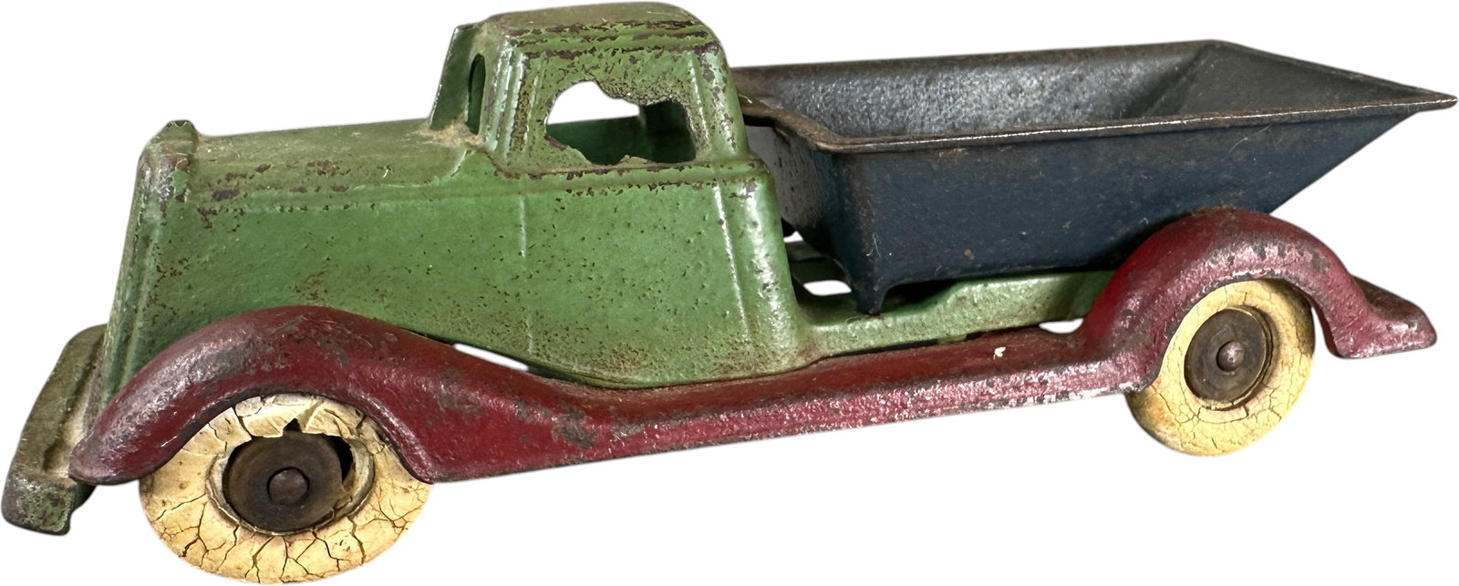 EARLY CHAMPION DUMP TRUCK: 295. EARLY CHAMPION DUMP TRUCK | Ex: Tony Lasala Collection. | 7.5" l. | One tire is distressed and flattened, needs cleaning to brighten paint, (Very Good to Excellent Condition) | $300 - $600