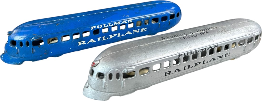 TWO ARCADE PULLMAN RAILPLANES: 325. TWO ARCADE PULLMAN RAILPLANES | Silver example has Chicago 1934 Century of Progress roof stencil. Provenance: Ira Bernstein Collection. | 9" l. | Silver example has extremely minor spot
