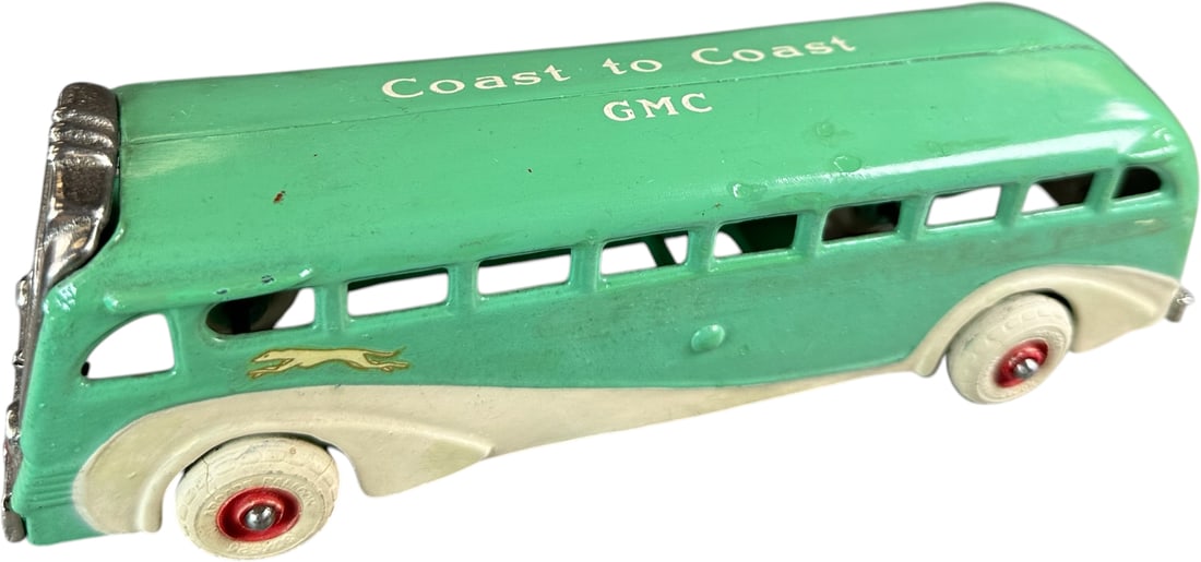 ARCADE GMC COAST TO COAST BUS: 330. ARCADE GMC COAST TO COAST BUS | Provenance: Ira Bernstein Collection. | 9" l. | Original paint and stenciling with small areas of spot touch-up where was worn on edges or at paint chips,