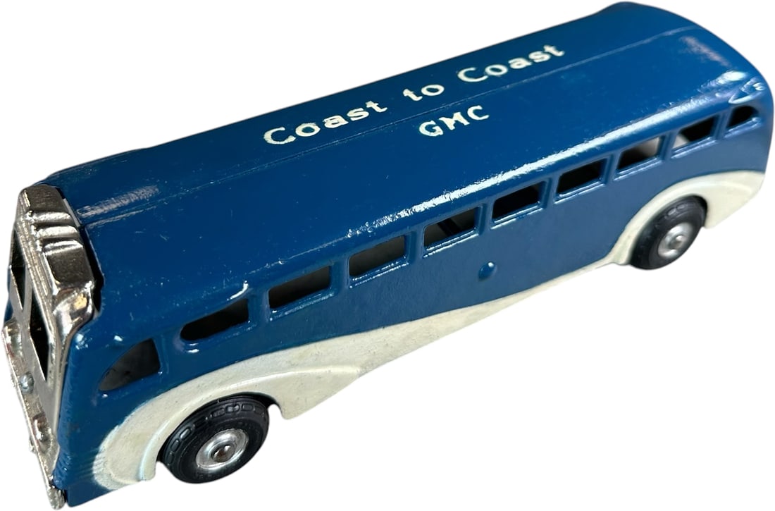 ARCADE GMC COAST TO COAST: 336. ARCADE GMC COAST TO COAST | Provenance: Ira Bernstein Collection. | 9" l. | Original roof stenciling, white paint has spot touch-ups, blue paint has overpaint, (Very Good Condition) | $200 - $400