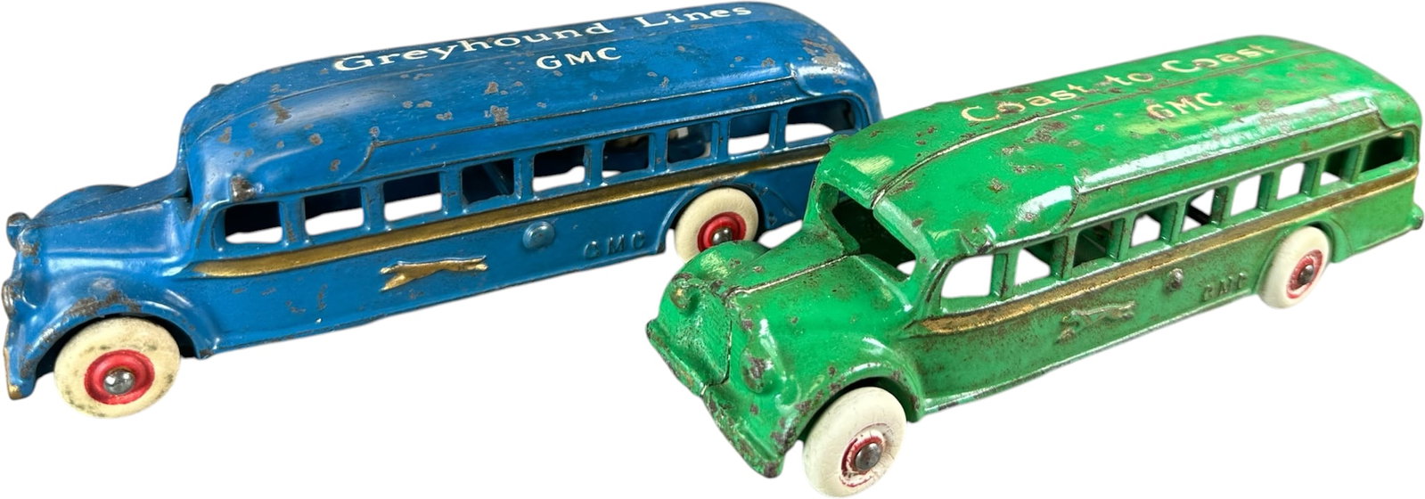 TWO ARCADE GMC GREYHOUND LINES BUSES: 337. TWO ARCADE GMC GREYHOUND LINES BUSES | Provenance: Ira Bernstein Collection. | 7.5" l. | Green has slightly more paint wear, (Very Good to Excellent Condition) | $200 - $400