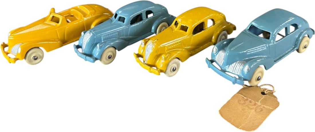 FOUR HUBLEY STORE STOCK SMALL AUTOS: 338. FOUR HUBLEY STORE STOCK SMALL AUTOS | Provenance: Ira Bernstein Collection. | 5" l. | One retains original showroom string tag, three cars with pinhead spot touch-ups, (Pristine Condition) | $300