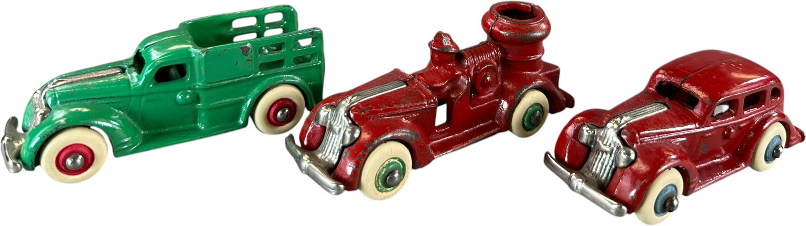 THREE ARCADE PONTIAC 1935 VEHICLES: 345. THREE ARCADE PONTIAC 1935 VEHICLES | Provenance: Ira Bernstein Collection. | 4.5" l. | Green car is wonderful, all original in (Excellent Condition) | $300 - $600