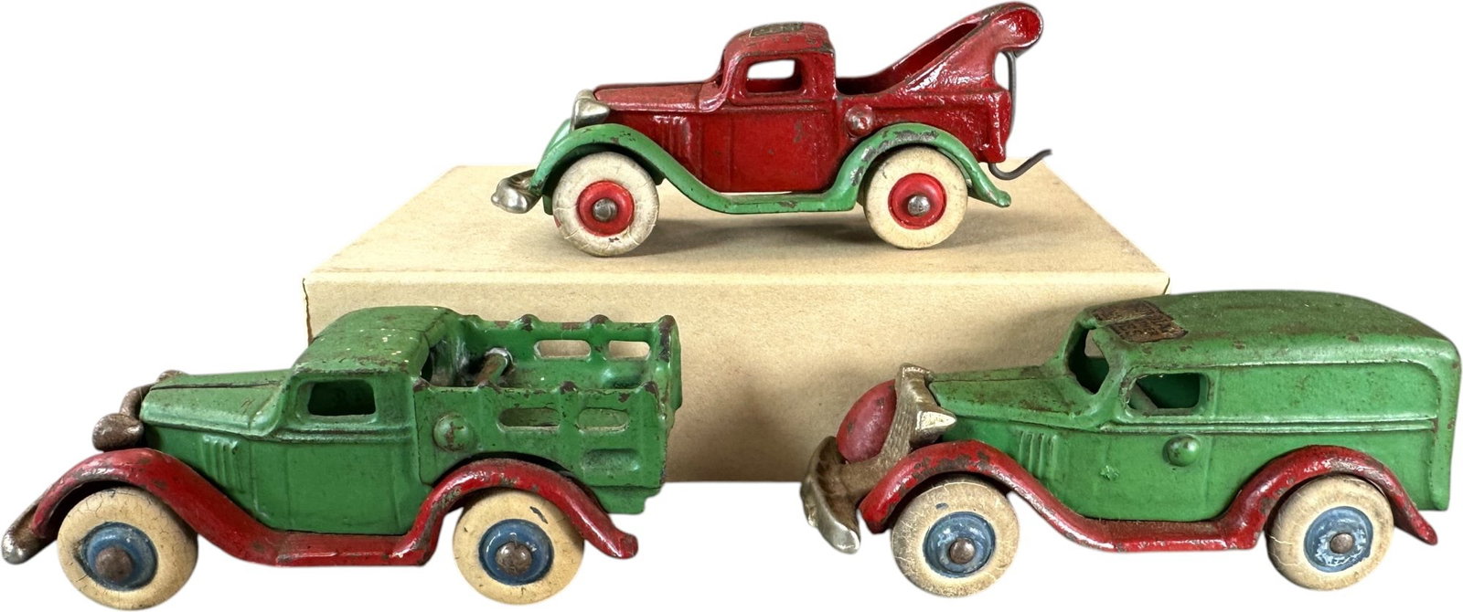 THREE SMALL ARCADE CONSTRUCTION AUTOS: 417. THREE SMALL ARCADE CONSTRUCTION AUTOS | Ex: Tony Lasala Collection. | 4" l. | (Very Good to Excellent Condition) | $250 - $500