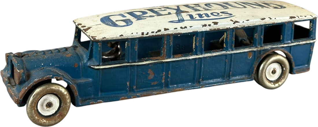 ARCADE FAGEOL COACH W/ GREYHOUND ROOF: 439. ARCADE FAGEOL COACH W/ GREYHOUND ROOF | Ex: Tony Lasala Collection. | 12" l. | Some paint flakes and crazing, reflects correctly under blacklight UV, overall (Very Good to Excellent Condition) |