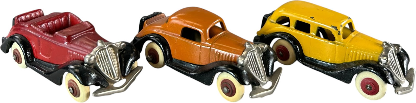 THREE HUBLEY TERRAPLANE VARIATIONS: 449. THREE HUBLEY TERRAPLANE VARIATIONS | Provenance: Ira Bernstein Collection. | 4.5" l. | One auto has darkening to edges of fenders, minor overpaint to top of red, (Excellent Condition) | $200 -