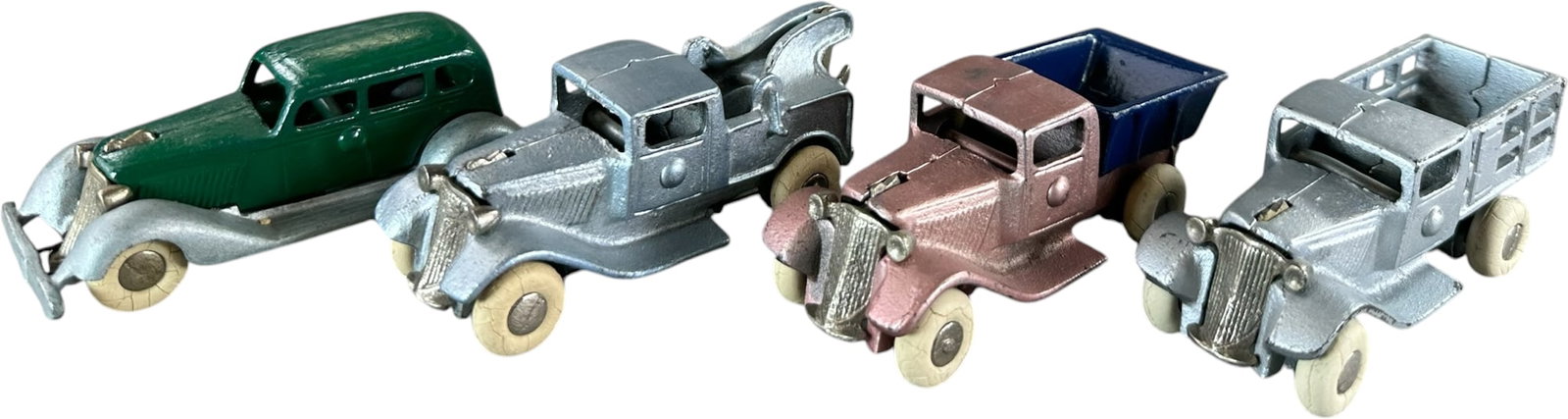 FOUR SMALL KILGORE GRAHAM VEHICLES: 450. FOUR SMALL KILGORE GRAHAM VEHICLES | Provenance: Ira Bernstein Collection. | 4" l. | Some overpaint to green body, others in (Excellent to Pristine Condition) | $200 - $300