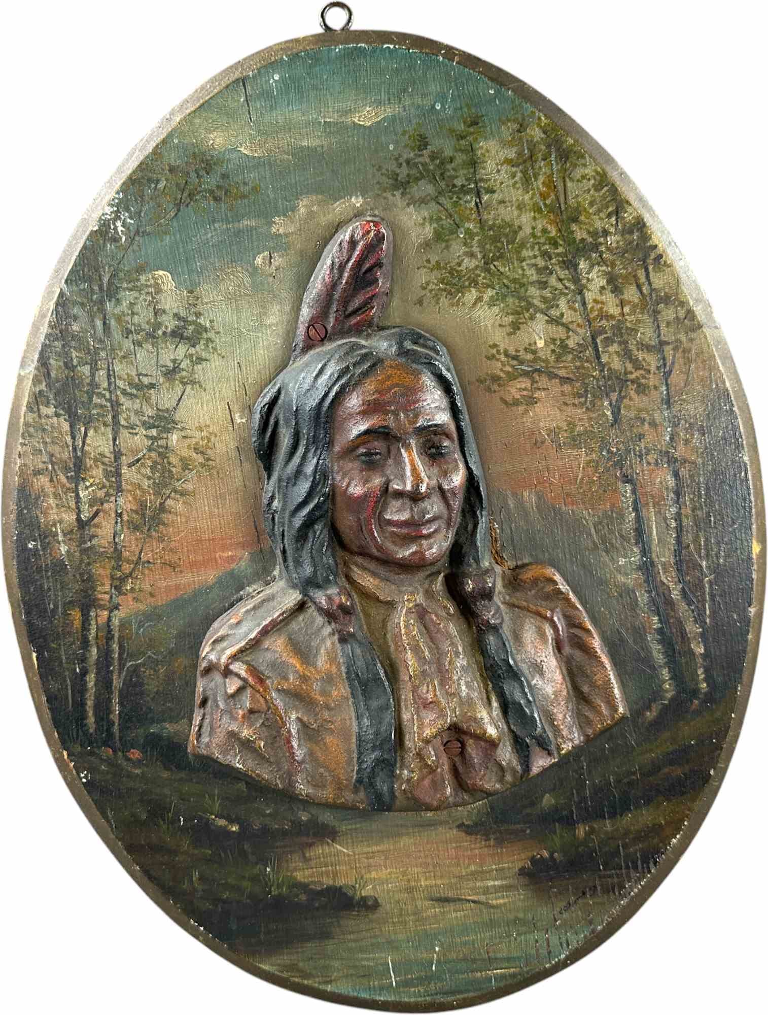 NATIVE AMERICAN PORTRAIT ADVERTISING PLAQUE: 34. NATIVE AMERICAN PORTRAIT ADVERTISING PLAQUE | Decorative plaque featuring a high-relief Native American portrait applied over a hand-painted woodland landscape. | CULTURAL DISCLAIMER: Certain anti