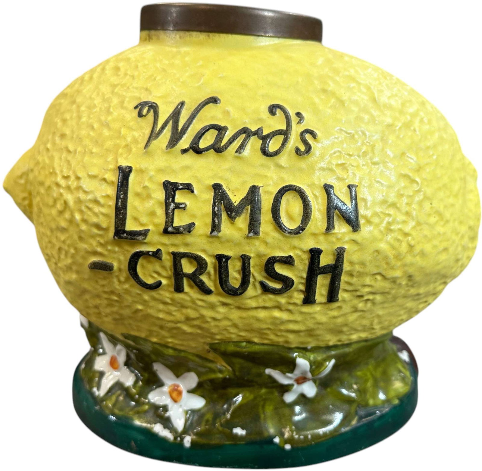 WARDS LEMON-CRUSH SYRUP DISPENSER: 50. WARDS LEMON-CRUSH SYRUP DISPENSER | Early ceramic soda fountain syrup dispenser, molded in the form of an oversized lemon with textured yellow surface, raised black lettering and applied floral