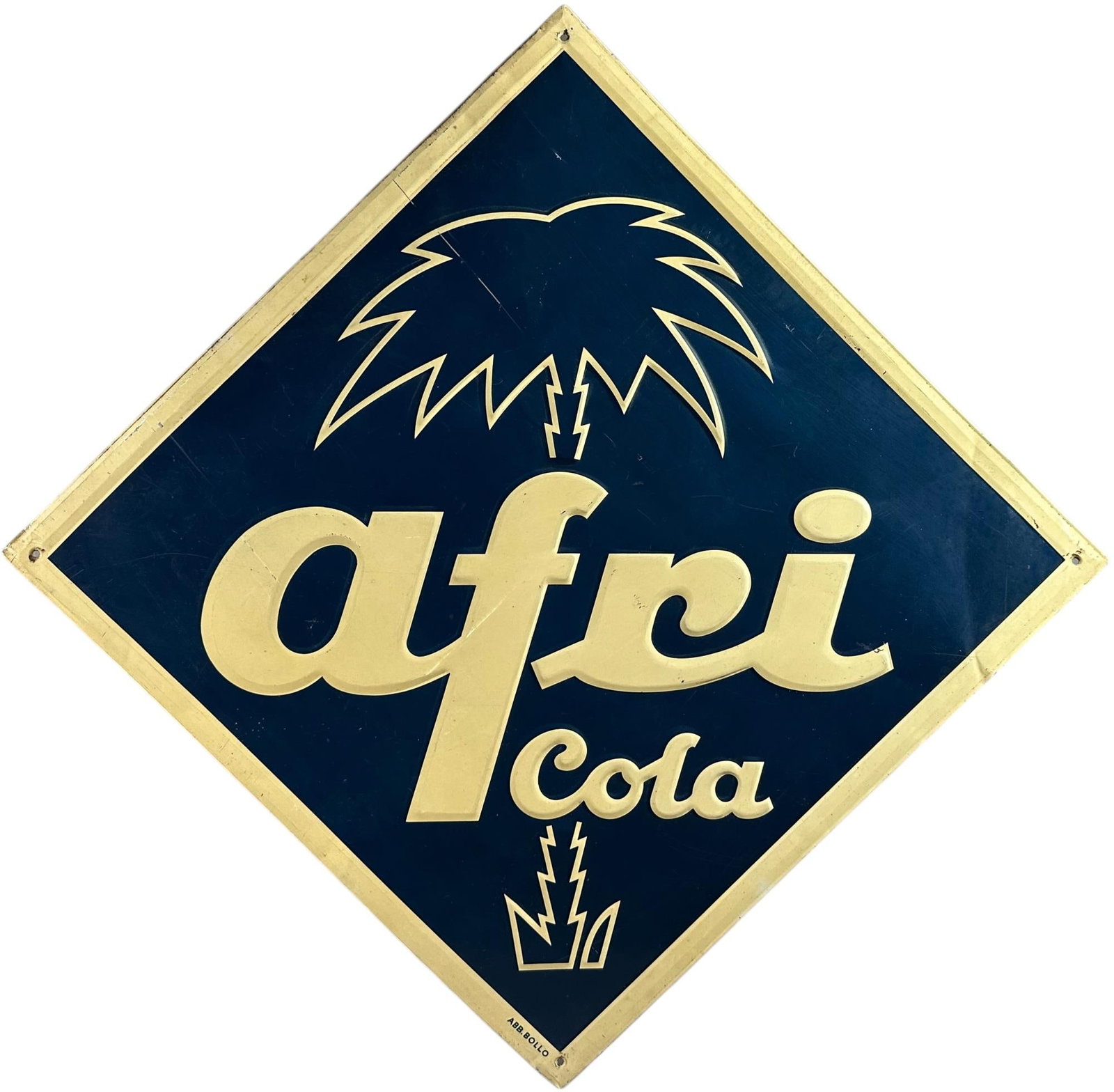 EMBOSSED TIN AFRI COLA SIGN: 60. EMBOSSED TIN AFRI COLA SIGN | 19.5 " l. x 19.5 " h. | (Excellent Condition) | $400 - $700