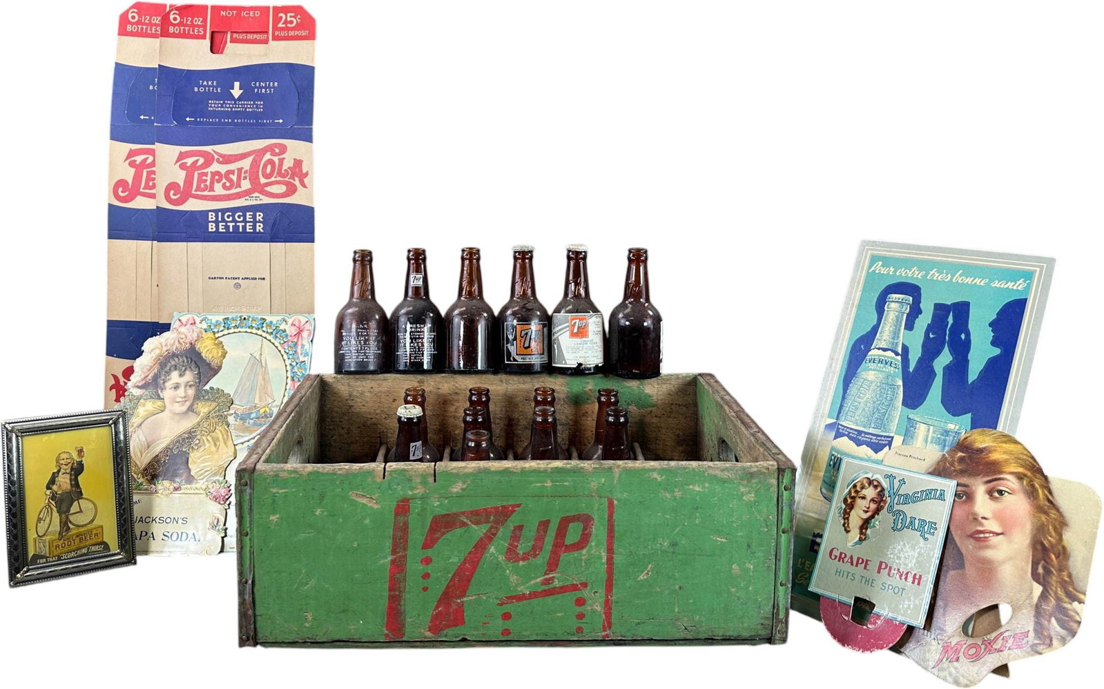 ASSORTED VINTAGE SODA ADVERTISING LOT: 61. ASSORTED VINTAGE SODA ADVERTISING LOT | Vintage soda advertising and packaging, including a painted wooden 7-Up bottle case with bottles, two Pepsi-Cola six-pack carriers, Evervess advertising