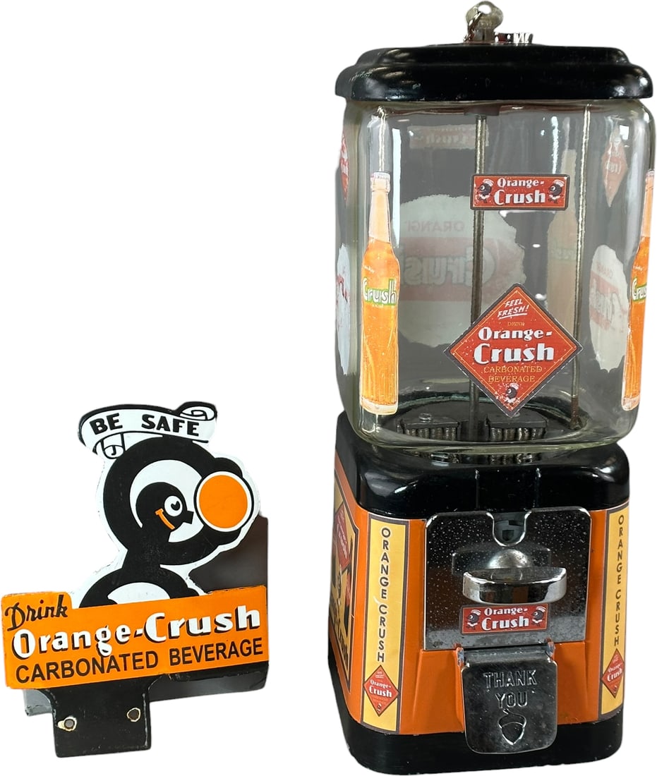 ORANGE CRUSH GUMBALL MACHINE & PORCELAIN SIGN: 152. ORANGE CRUSH GUMBALL MACHINE & PORCELAIN SIGN | 16" h. | Authentic machine has some professional refinishing, displays in (Excellent Condition) | $200 - $400
