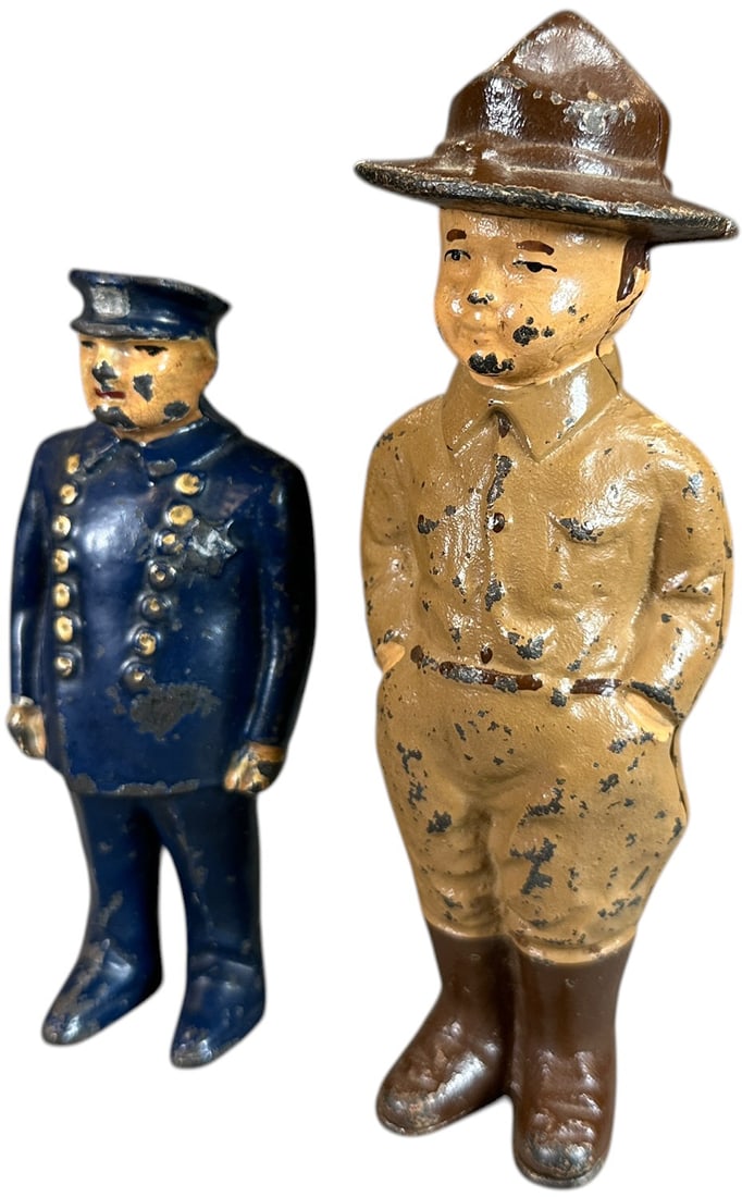 DOUGHBOY AND ARCADE COP STILL BANK: 210. DOUGHBOY AND ARCADE COP STILL BANK | 7" h. | (Very Good to Excellent Condition) | $300 - $600