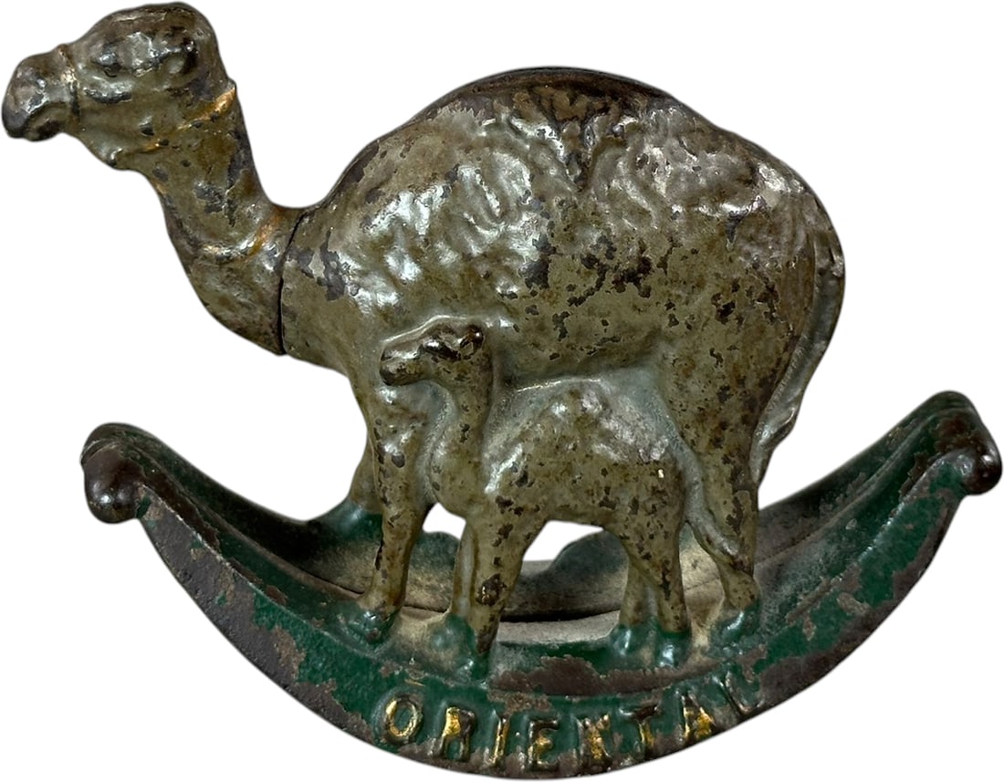 ORIENTAL CAMEL STILL BANK: 212. ORIENTAL CAMEL STILL BANK | US, maker unknown. | 5.5" l. | Paint wear consistent with handling, (Excellent Condition) | $400 - $600