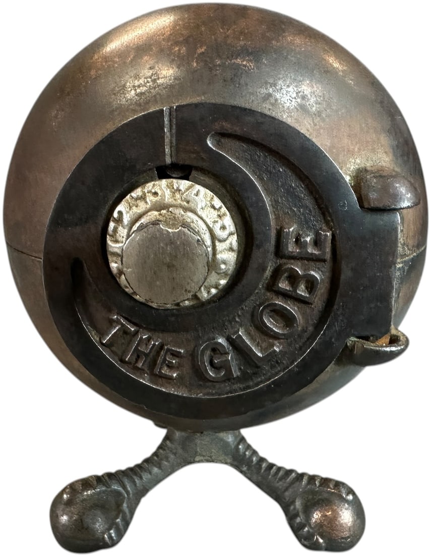 ELECTROPLATED GLOBE STILL BANK: 219. ELECTROPLATED GLOBE STILL BANK | Kenton Hardware, Ohio. | 5.5" h. | Missing part of locking mechanism, (Excellent Condition) | $150 - $300