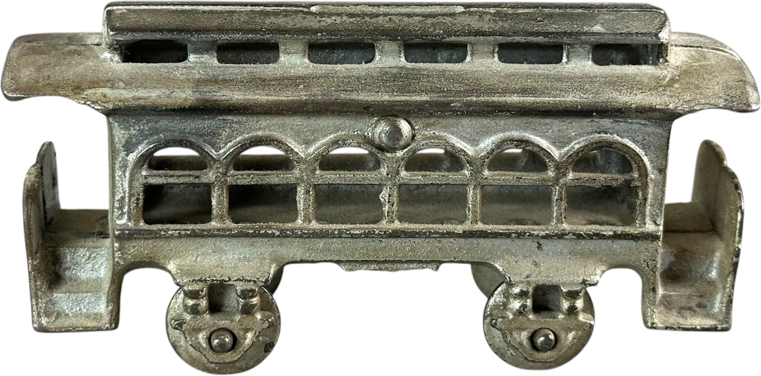 TROLLEY CAR STILL BANK: 235. TROLLEY CAR STILL BANK | Kenton Hardware, Ohio. | 5.5" l. | All original with an authentic casting flaw on the floor of one end ramp, (Excellent Condition) | $200 - $300