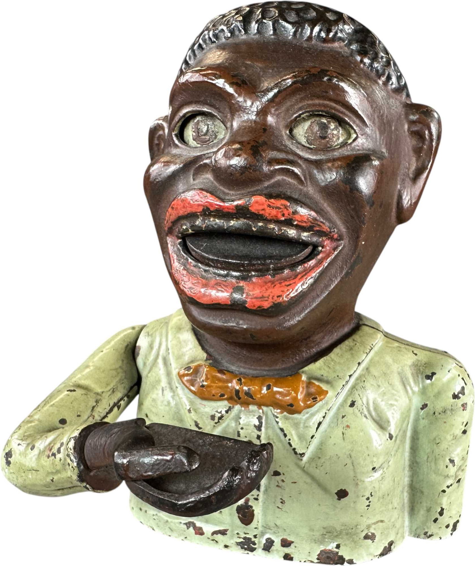 THE HAPPY MAN MECHANICAL BANK - GREEN: 251. THE HAPPY MAN MECHANICAL BANK - GREEN | Cast iron. | CULTURAL DISCLAIMER: Certain antique and vintage items in this sale include imagery or themes that reflect racial stereotypes now recognized a