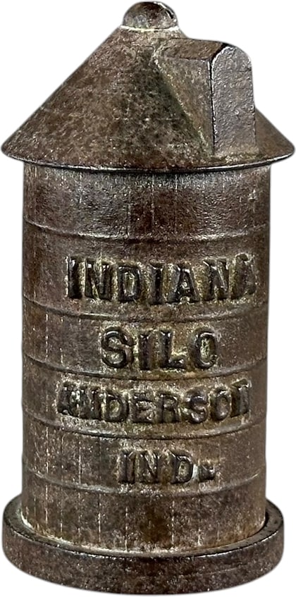 INDIANA SILO STILL BANK: 286. INDIANA SILO STILL BANK | 4" h. | Minor blow hole casting flaw to side, (Very Good to Excellent Condition) | $300 - $600