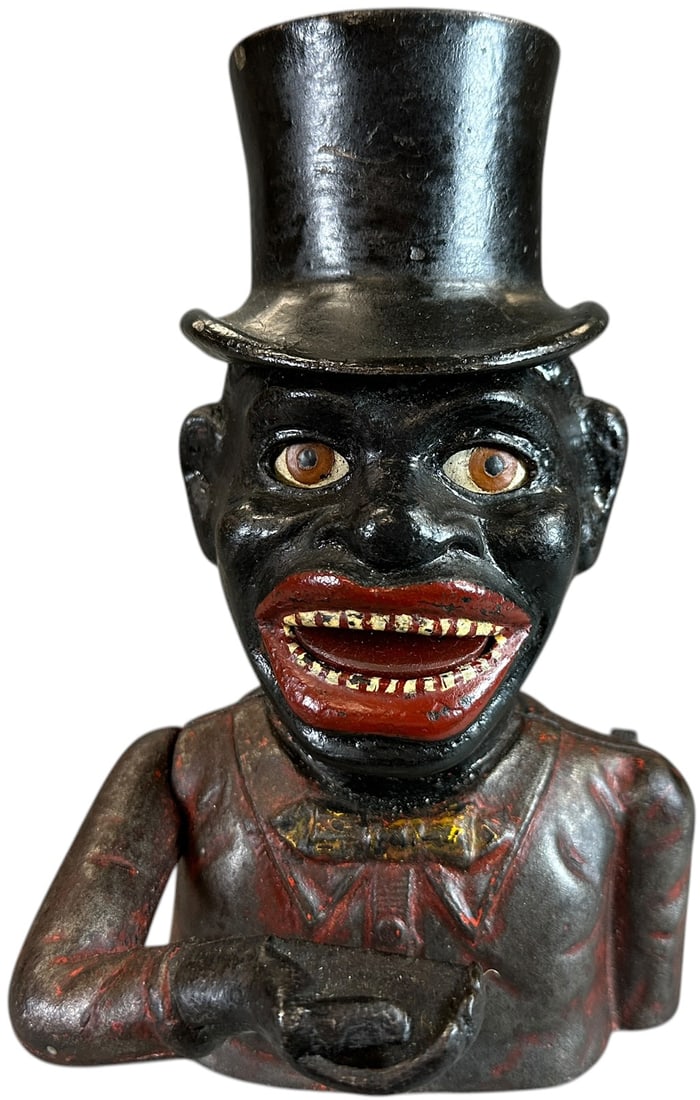 HAPPY MAN W/ TOP HOT MECHANICAL BANK: 339. HAPPY MAN W/ TOP HOT MECHANICAL BANK | Marked Shepard Hardware on base. | CULTURAL DISCLAIMER: Certain antique and vintage items in this sale include imagery or themes that reflect racial stereot