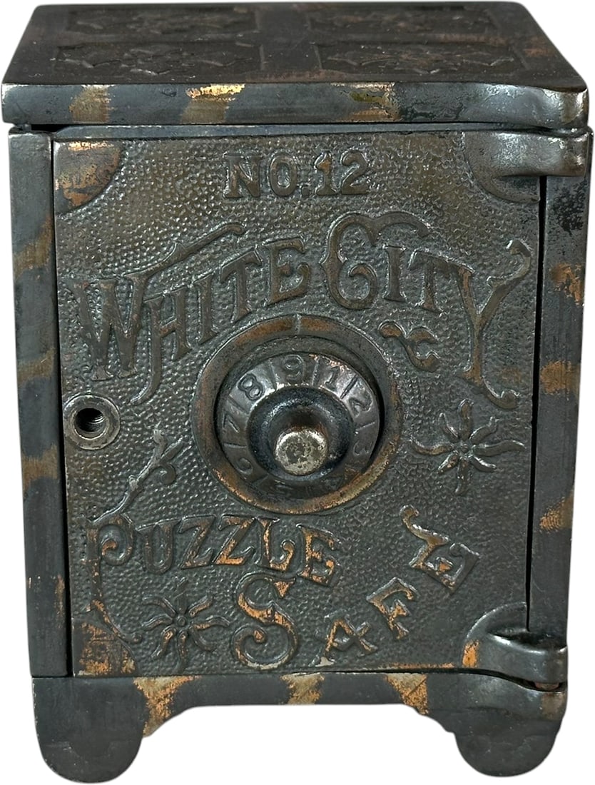 WHITE CITY PUZZLE SAFE STILL BANK: 370. WHITE CITY PUZZLE SAFE STILL BANK | Nicol & Co Mfg. | 5" h. | Missing knob, glued crack to baseplate, otherwise (Excellent Condition) | $100 - $200