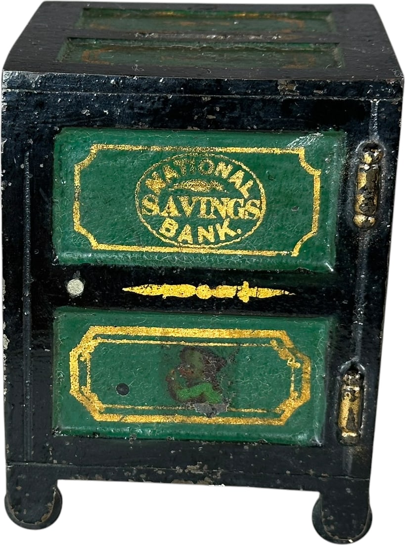 NATIONAL SAVINGS SAFE STILL BANK: 375. NATIONAL SAVINGS SAFE STILL BANK | Maker unknown, c. 1880. | 4.5" h. | Still retains faded decal of child on front, nice original paint, (Excellent Condition) | $200 - $400