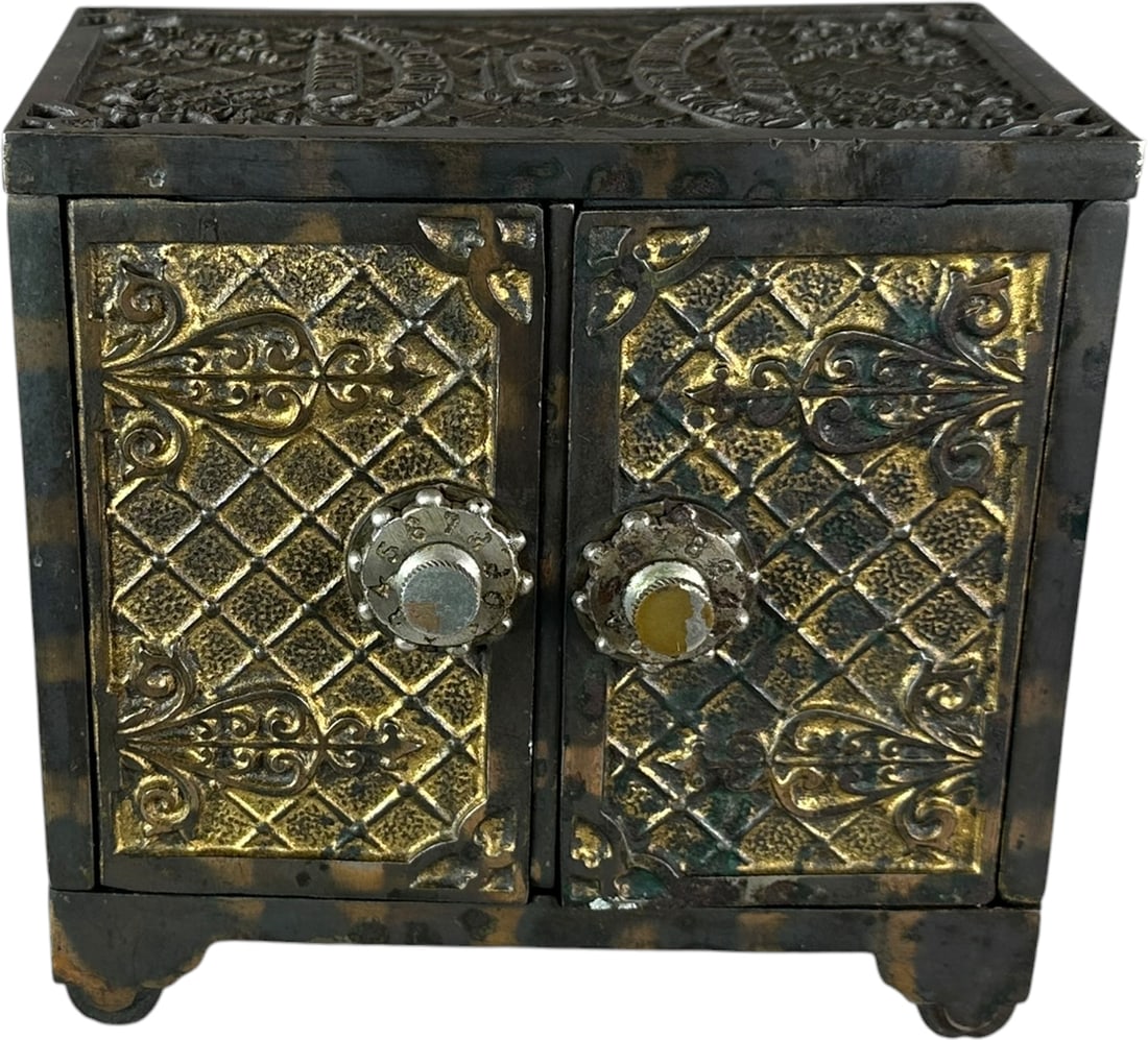 CHICAGO SAVINGS/NEW YORK NATIONAL BANK SAFE STILL: 380. CHICAGO SAVINGS/NEW YORK NATIONAL BANK SAFE STILL | Kenton, c.1900, copper electroplate. | 6" h. | (Excellent Condition) | $300 - $600