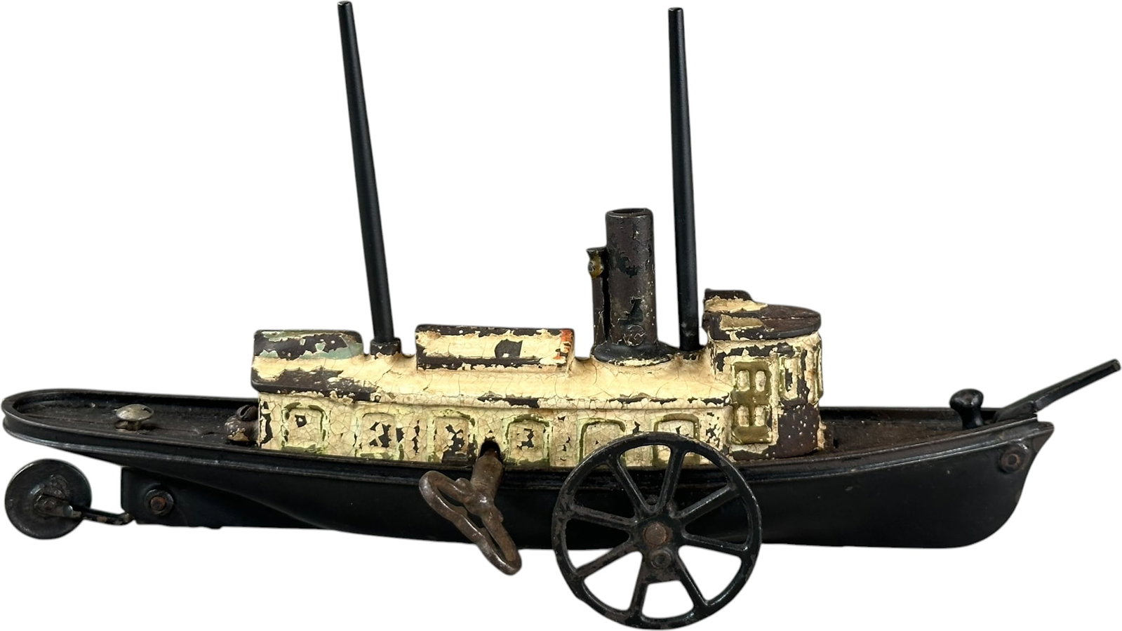 IVES CAST IRON FLOOR YACHT: 387. IVES CAST IRON FLOOR YACHT | Reportedly sold in two versions; clockwork driven and as a floor toy, this is the first example we have come across which still retains some of the fragments of an