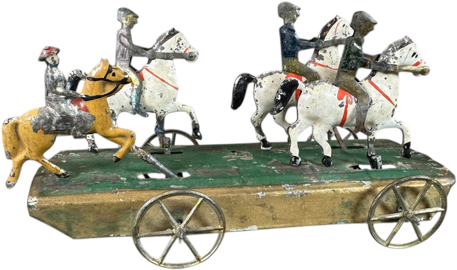 FALLOWS JEROME PARK PULL TOY: 402. FALLOWS JEROME PARK PULL TOY | Provenance: Richard Mueller Collection. | 9" l. | Resoldered rods to hoofs, one figure added, gold is added to edge of frame by child, a few spots of resolder at
