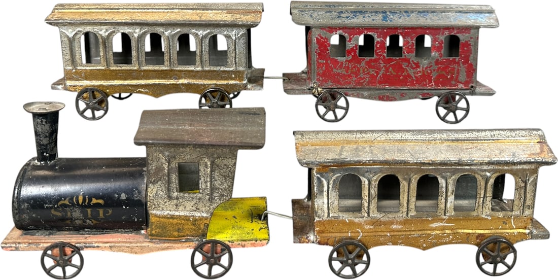 FOUR PIECE AMERICAN TIN TRAIN: 404. FOUR PIECE AMERICAN TIN TRAIN | 6" l. loco | (Very Good Condition) | $250 - $500