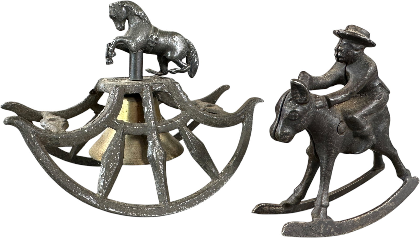 TWO SMALL ROCKING CAST IRON TOYS: 410. TWO SMALL ROCKING CAST IRON TOYS | Lot includes an Ives rocking horse toy and a horse theme counter rocking bell. | 4.5" l. | Mule is missing tail, (Very Good Condition) | $200 - $400